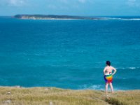 On the east side of Pinel Island Paula gazes at Tintamarre Island. Tintamarre is a popular place and several boats are achored there as you can see.